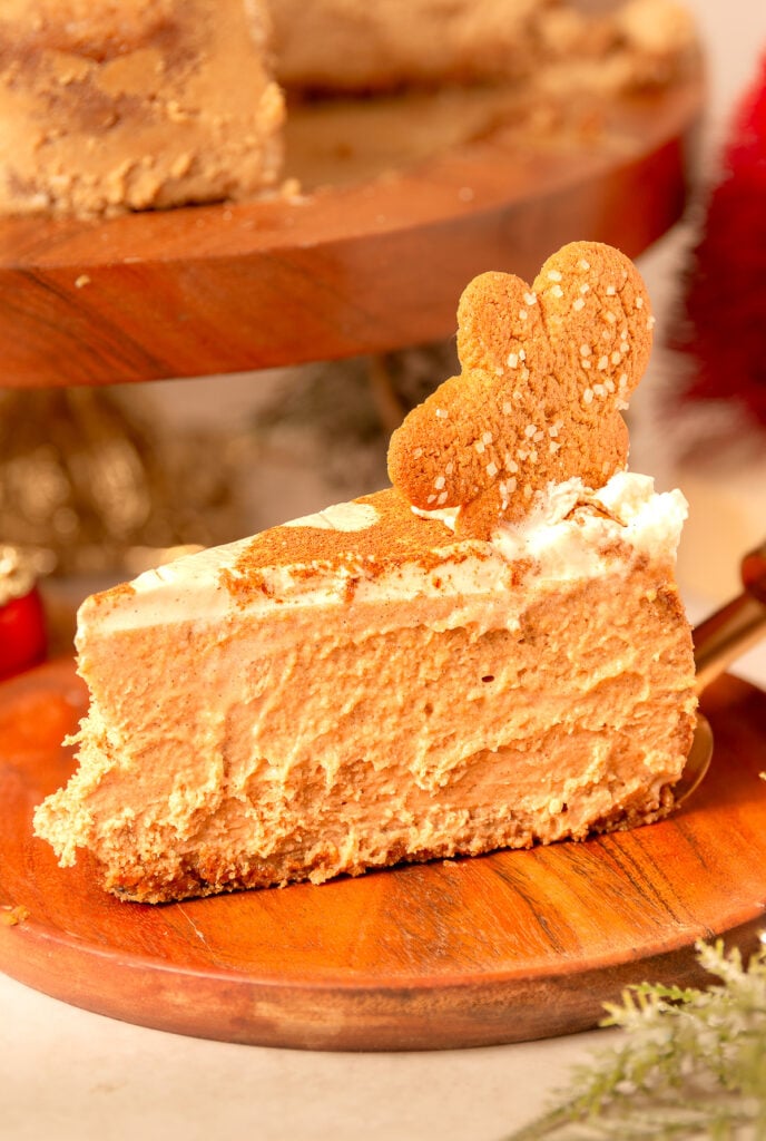 slice of ginger bread cheesecake on a wooden plate