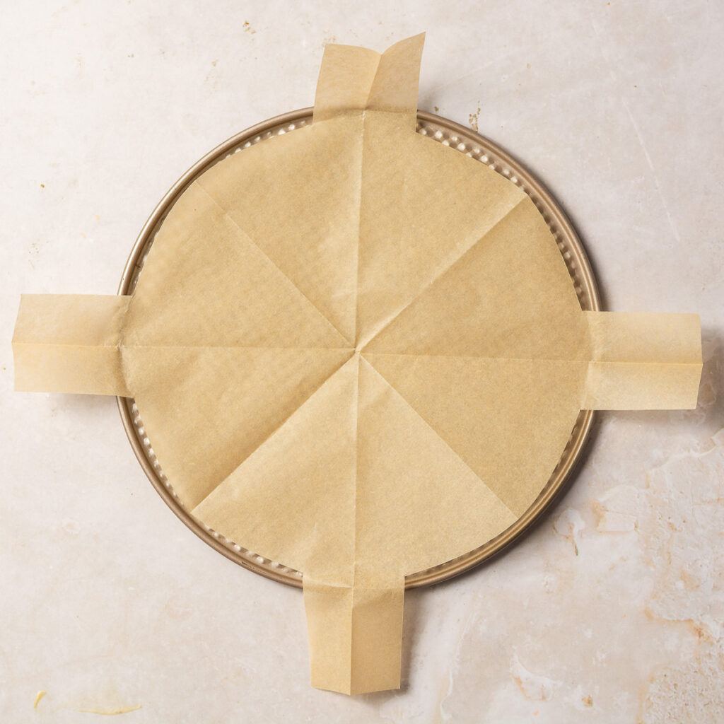 parchment paper circle cut out with 4 tabs