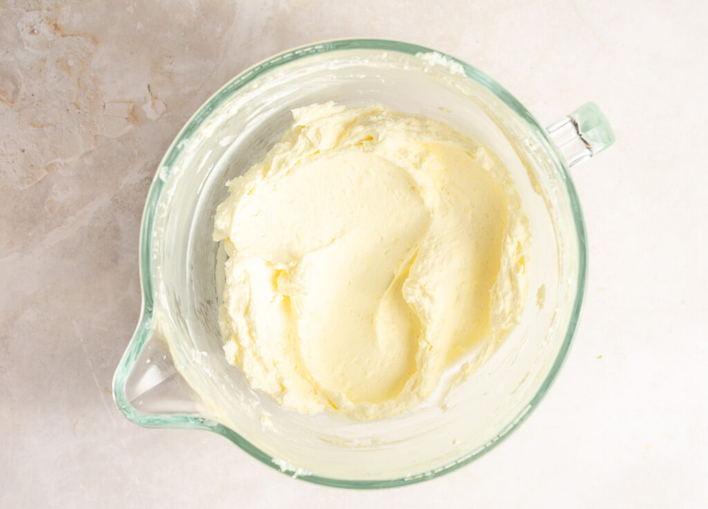 beat cream cheese in a mixing bowl