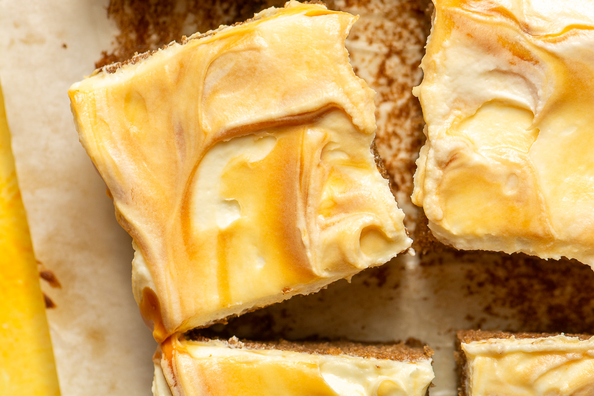 slices of banana caramel sheet cake on parchment paper