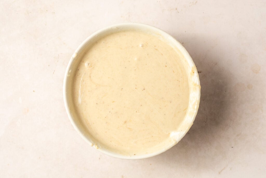 pureed banana and greek yogurt in a bowl