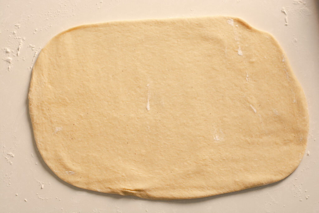 banana dough rolled out on a counter