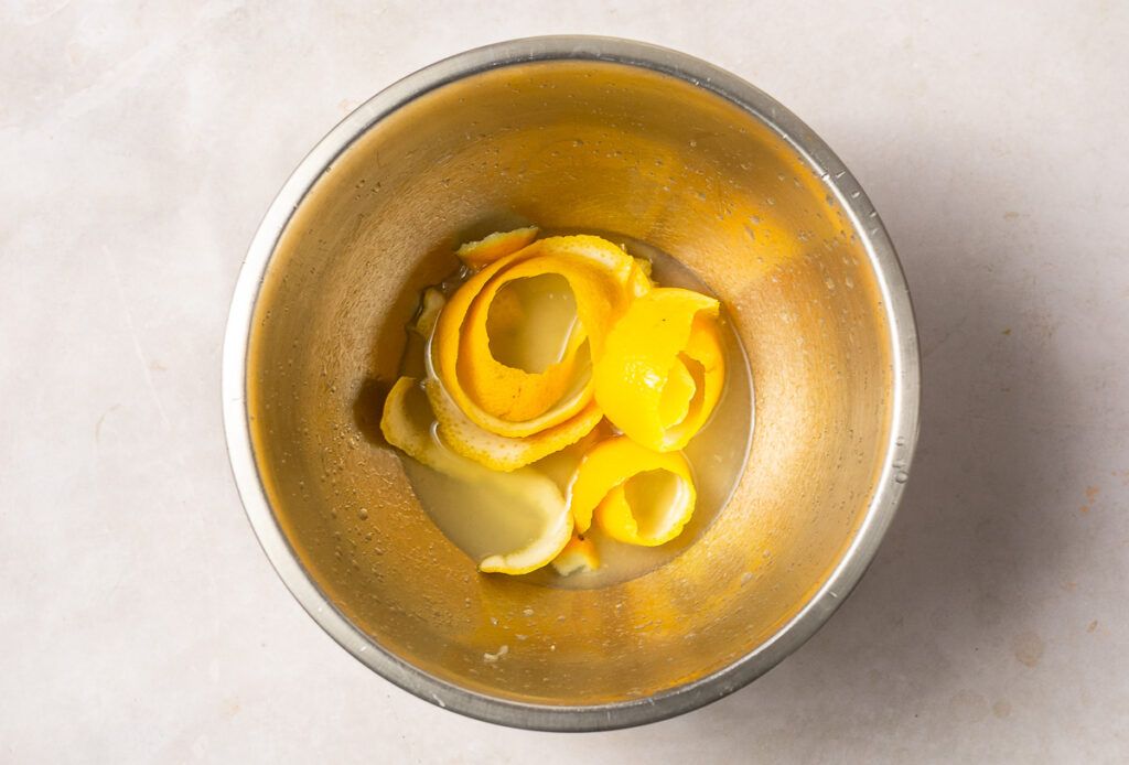 lemon rind and juice in a stainless steel bowl