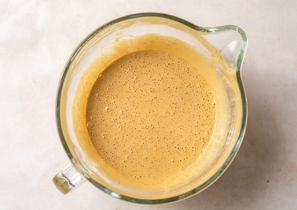 whipped eggs in a glass bowl