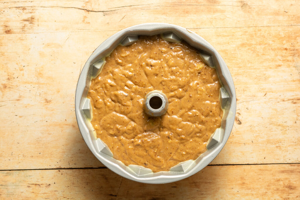 hummingbird cake batter in a bundt pan