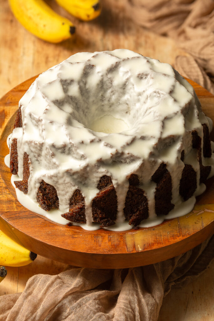 hummingbird bundt cake on a cake stand