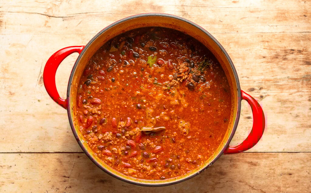 making beef and chorizo chili in a dutch oven