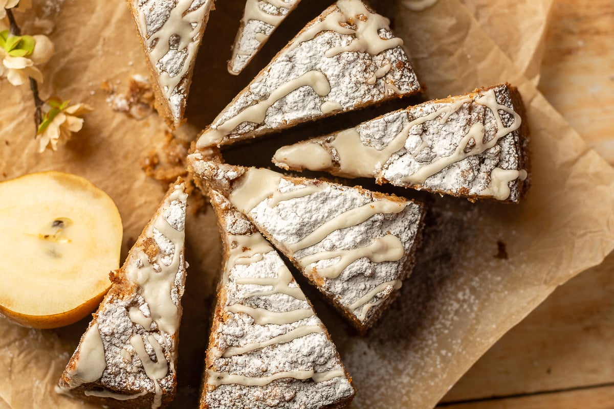 slices of spiced pear crumb cake arranged on parchment paper