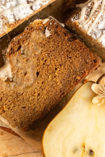 slice of spiced pear crumb cake on parchment paper