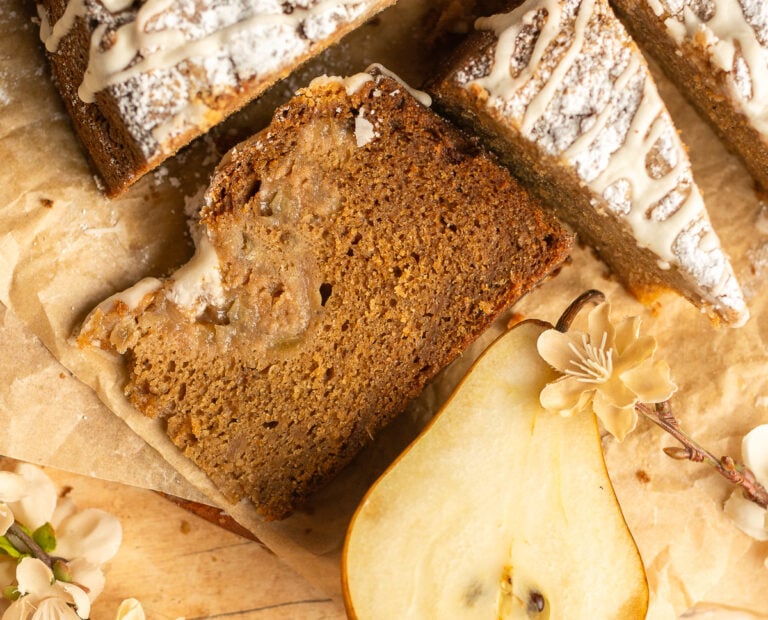 slice of spiced pear crumb cake on parchment paper
