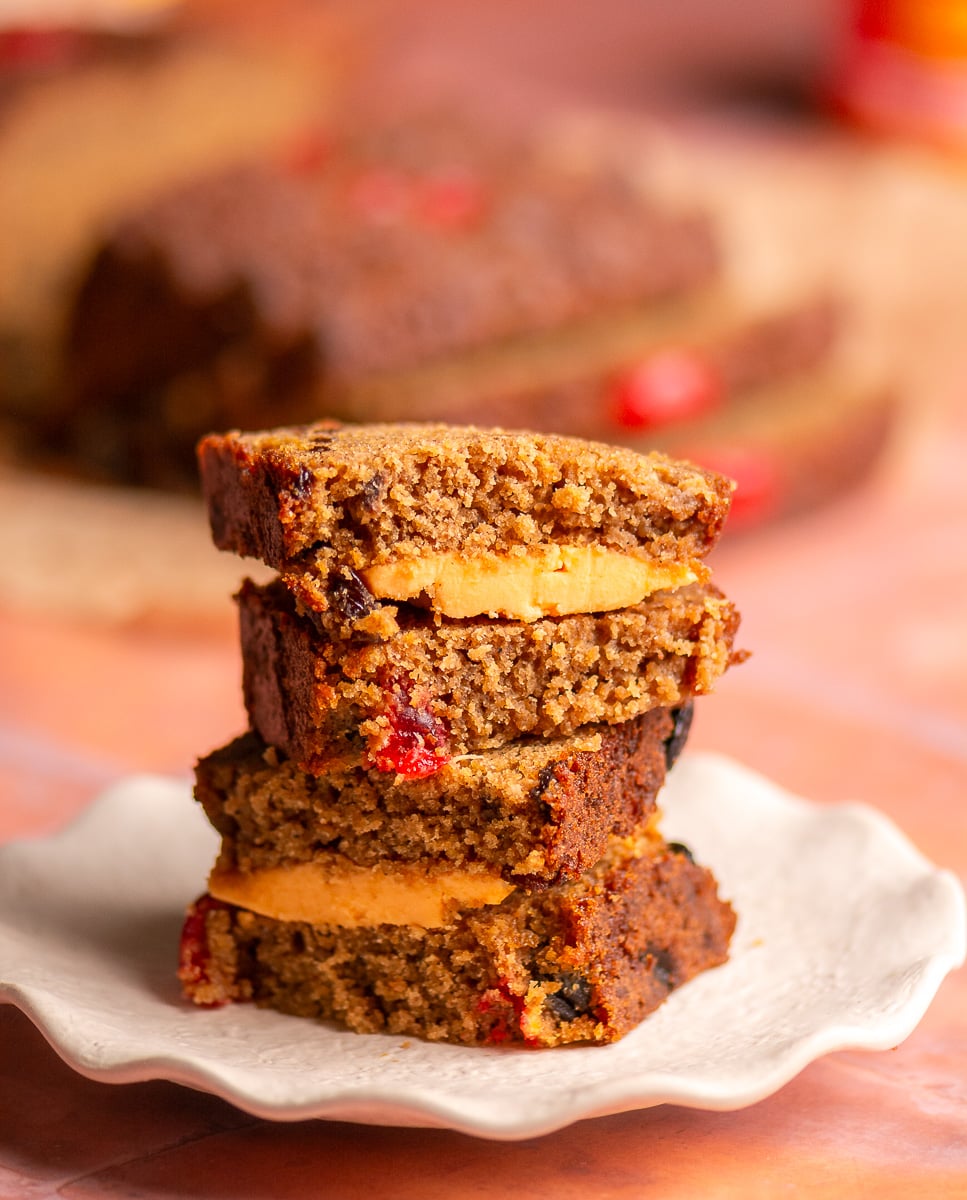 Jamaican easter bun sandwich with sliced cheddar cheese on a plate.