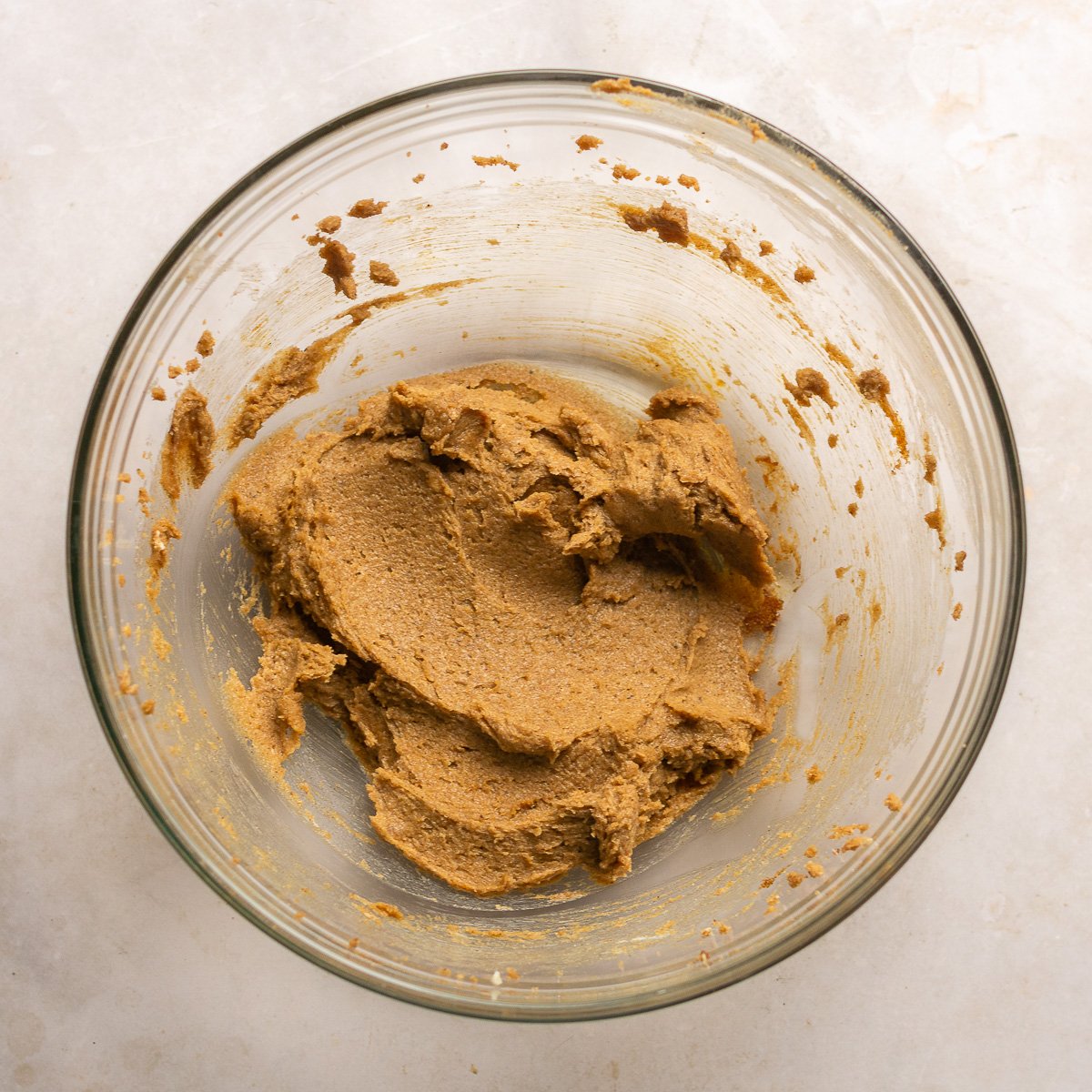 creamed butter, brown sugar ans spices in a glass mixing bowl.