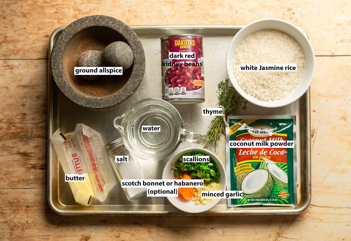 ingredients for Quick Jamaican Rice and Peas with Canned Beans - white Jasmine rice, dark red kidney beans, ground allspice, butter, coconut milk powder, scallions, garlic, thyme & salt.