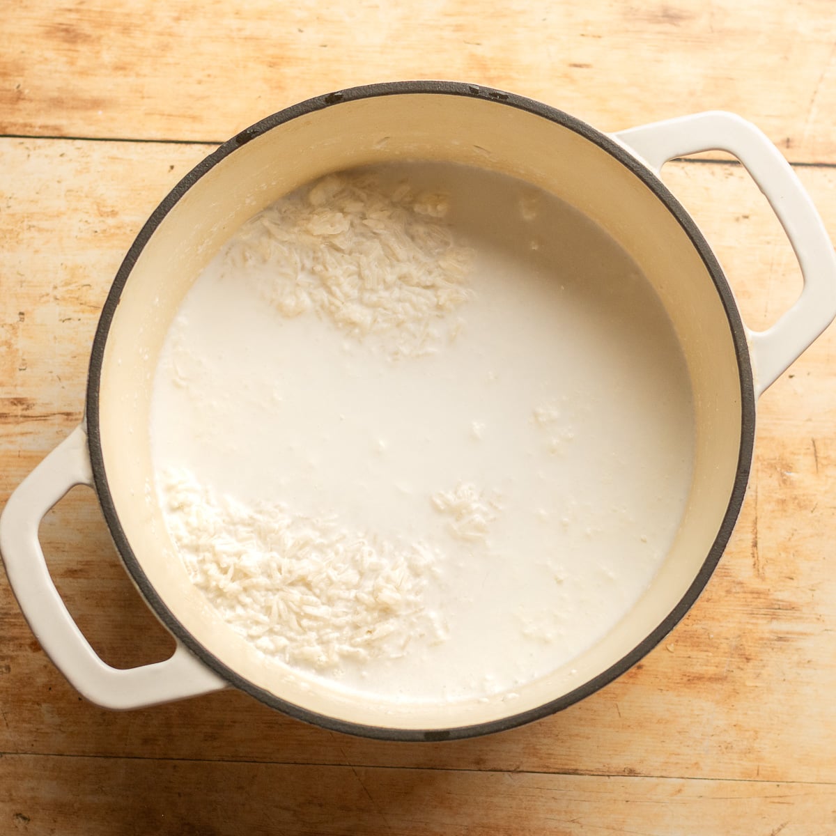 white Jasmine rice and coconut milk in a dutch oven