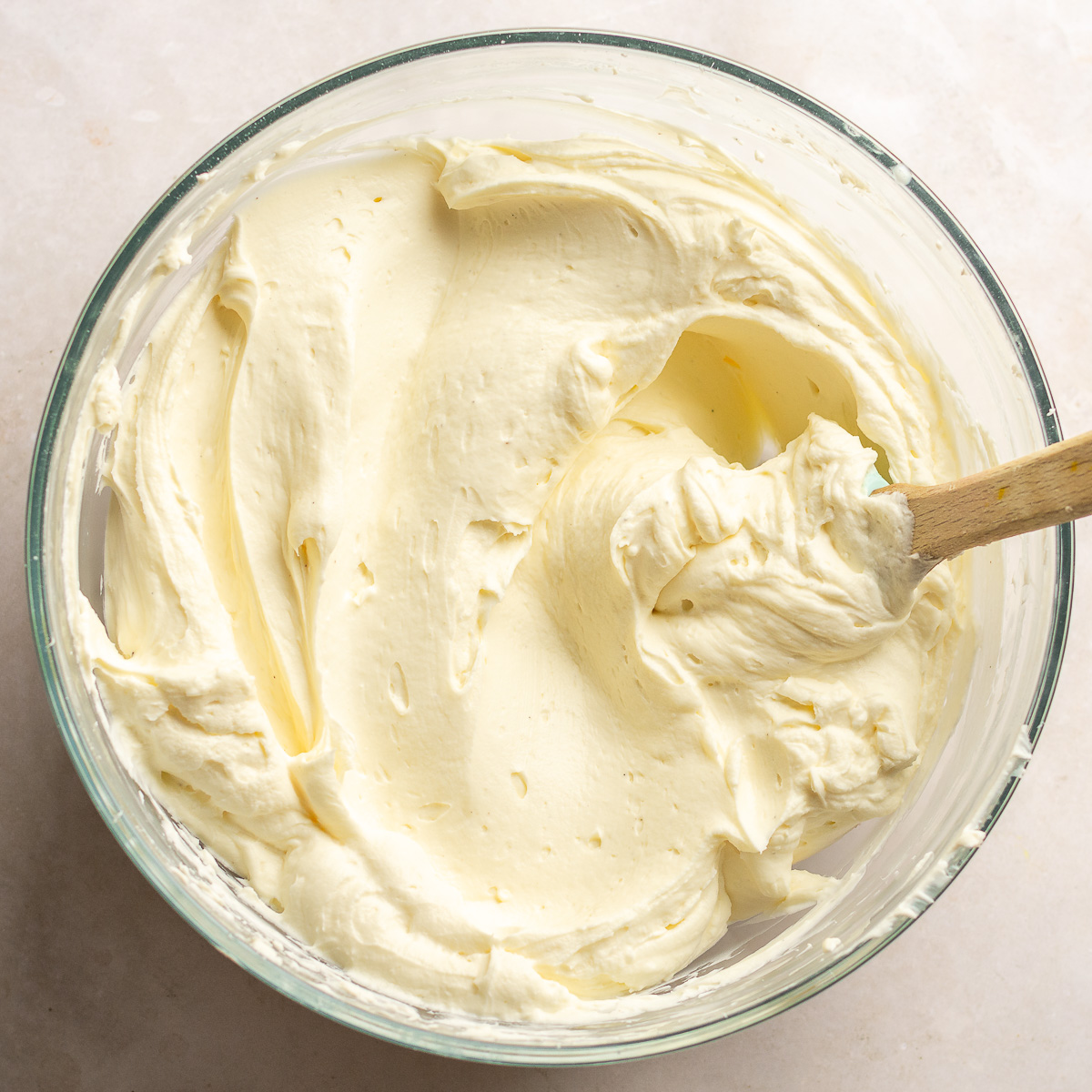 cream cheese frosting in a glass bowl.