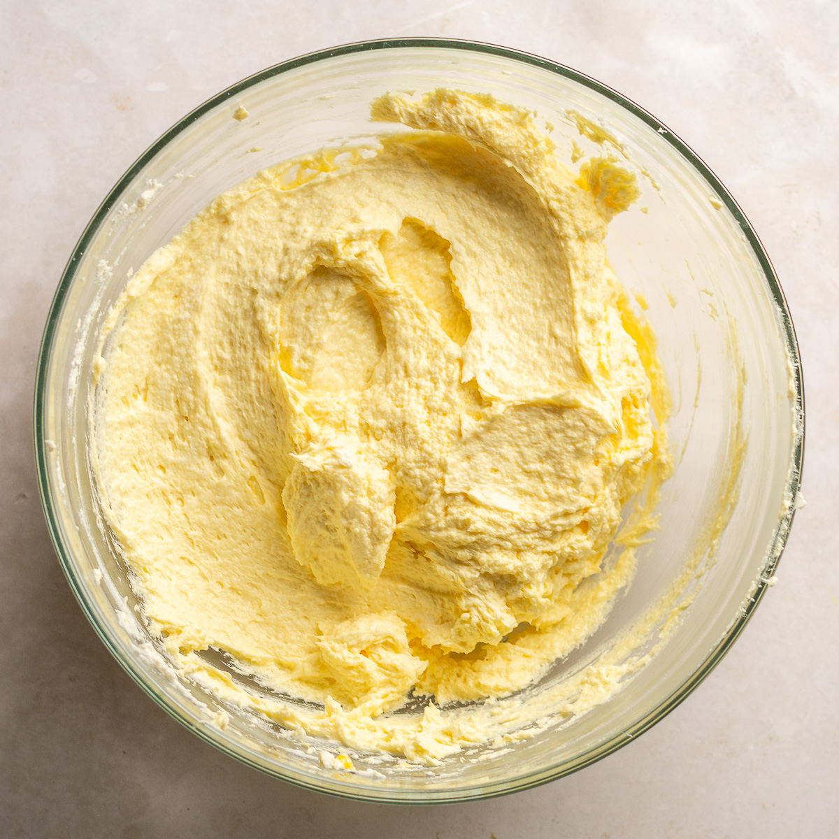 eggs added to creamed butter, oil and sugar in a glass bowl. 