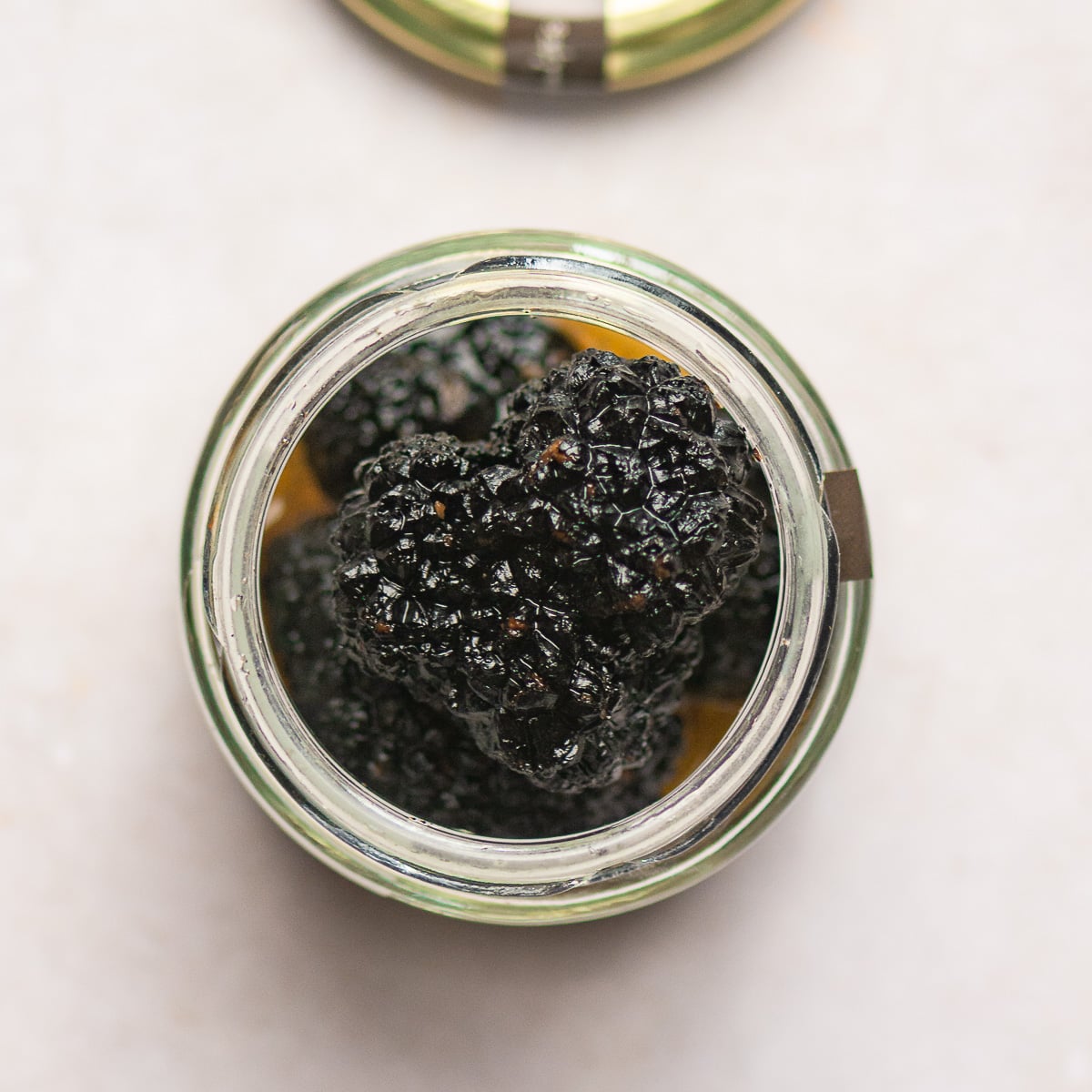 preserved whole truffles in a jar.