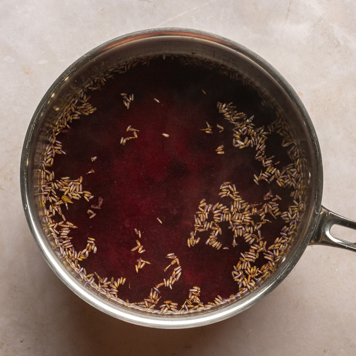steeping lavender buds with blueberry compote and water.