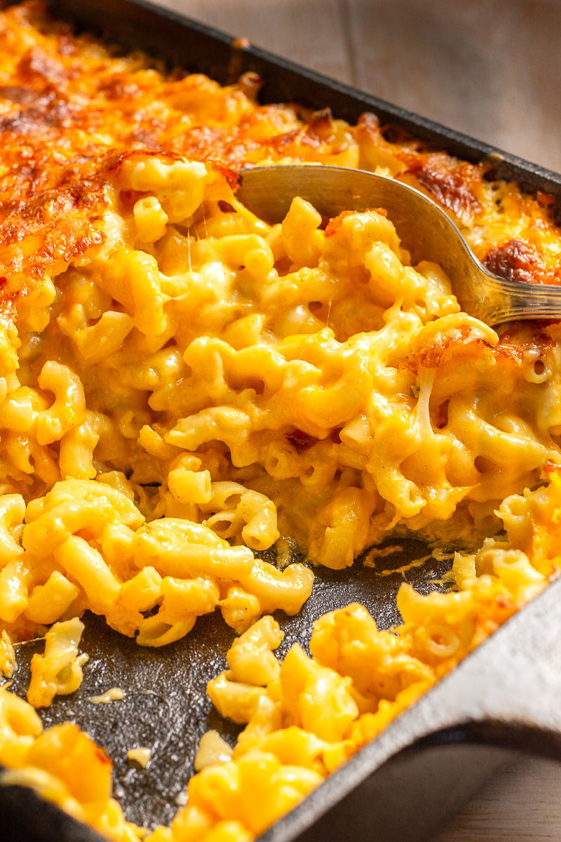 old-fashioned mac and cheese in a cast-iron casserole dish.