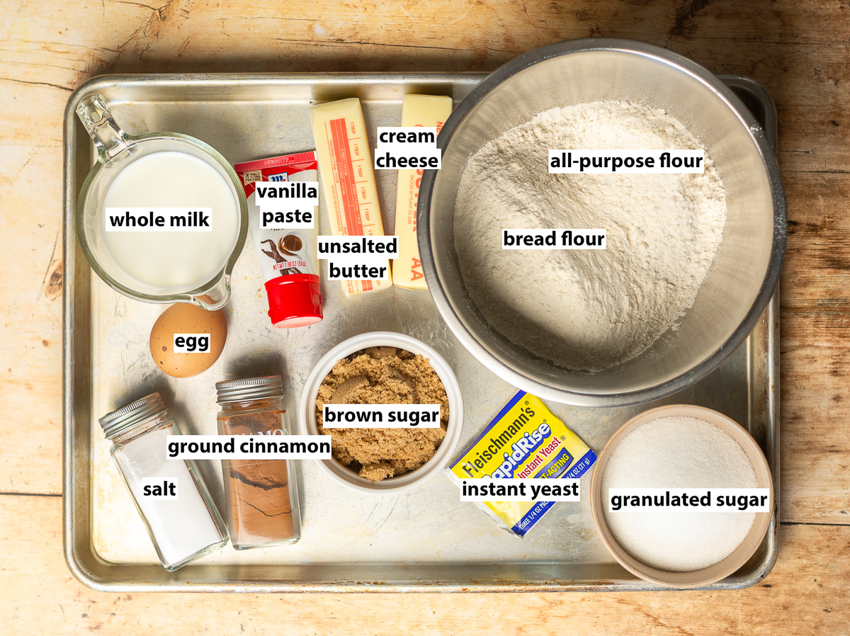 ingredients for homemade cinnamon buns - bread flour, all-purpose flour, instant yeast, butter, brown sugar, cinnamon, whole milk, vanilla paste, egg, salt.