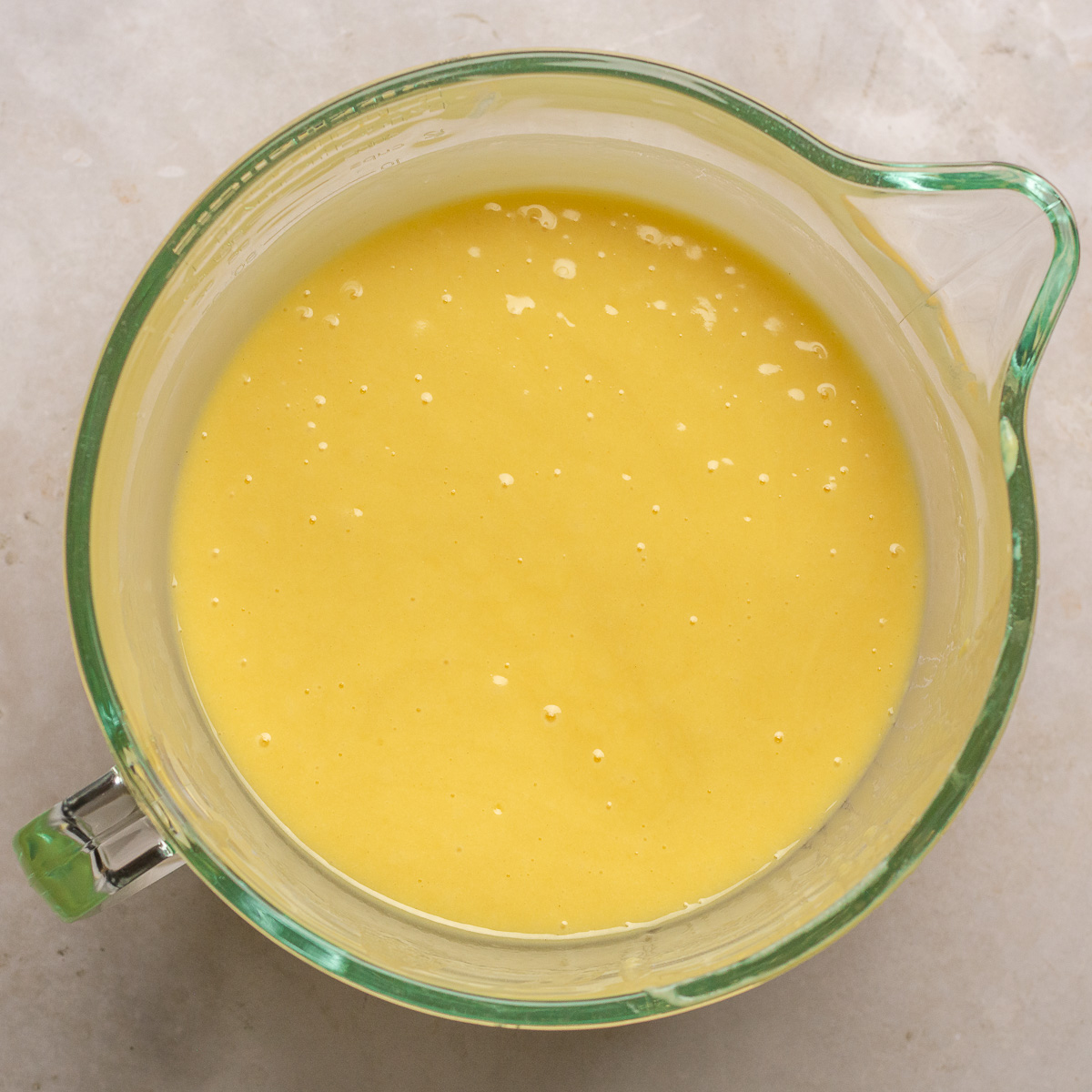 lemon yogurt cake batter in a glass mixing bowl.