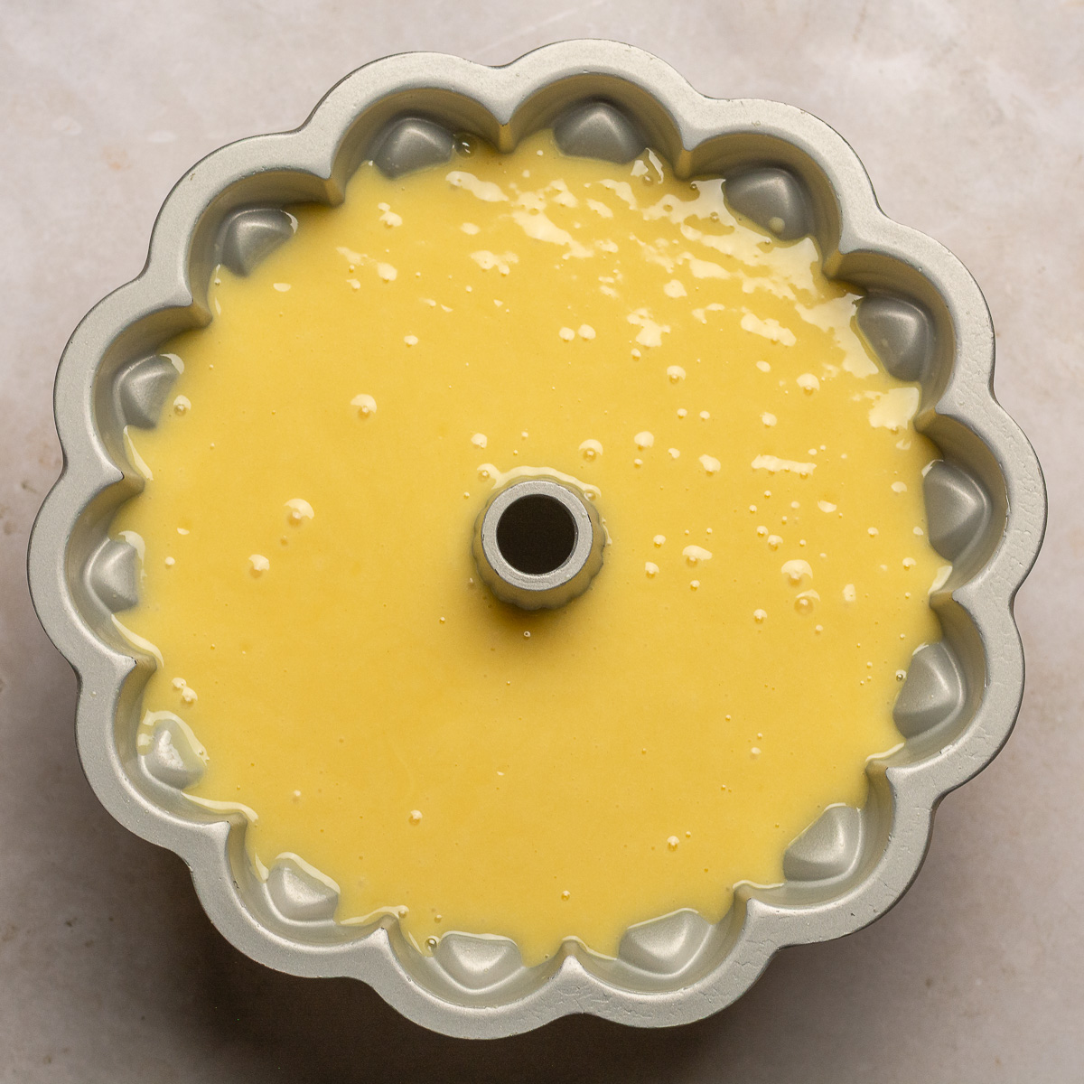 lemon yogurt cake batter in a bundt pan.