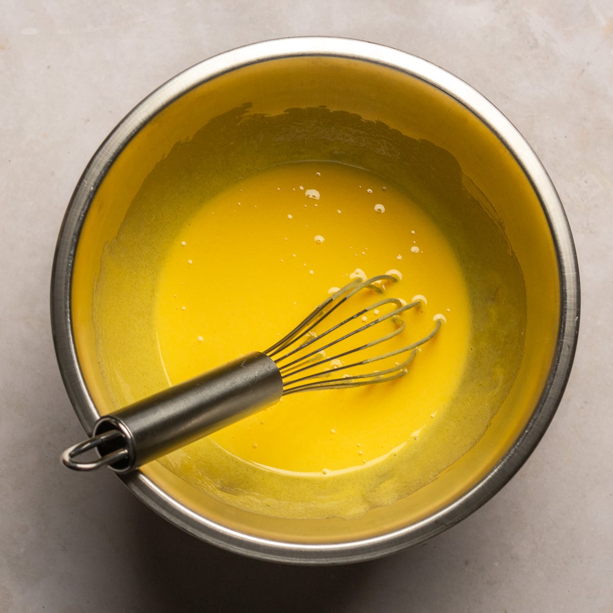 egg yolks whipped with granulated sugar.