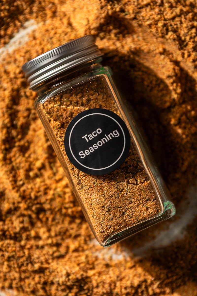 filled spice jar with "taco seasoning" label.