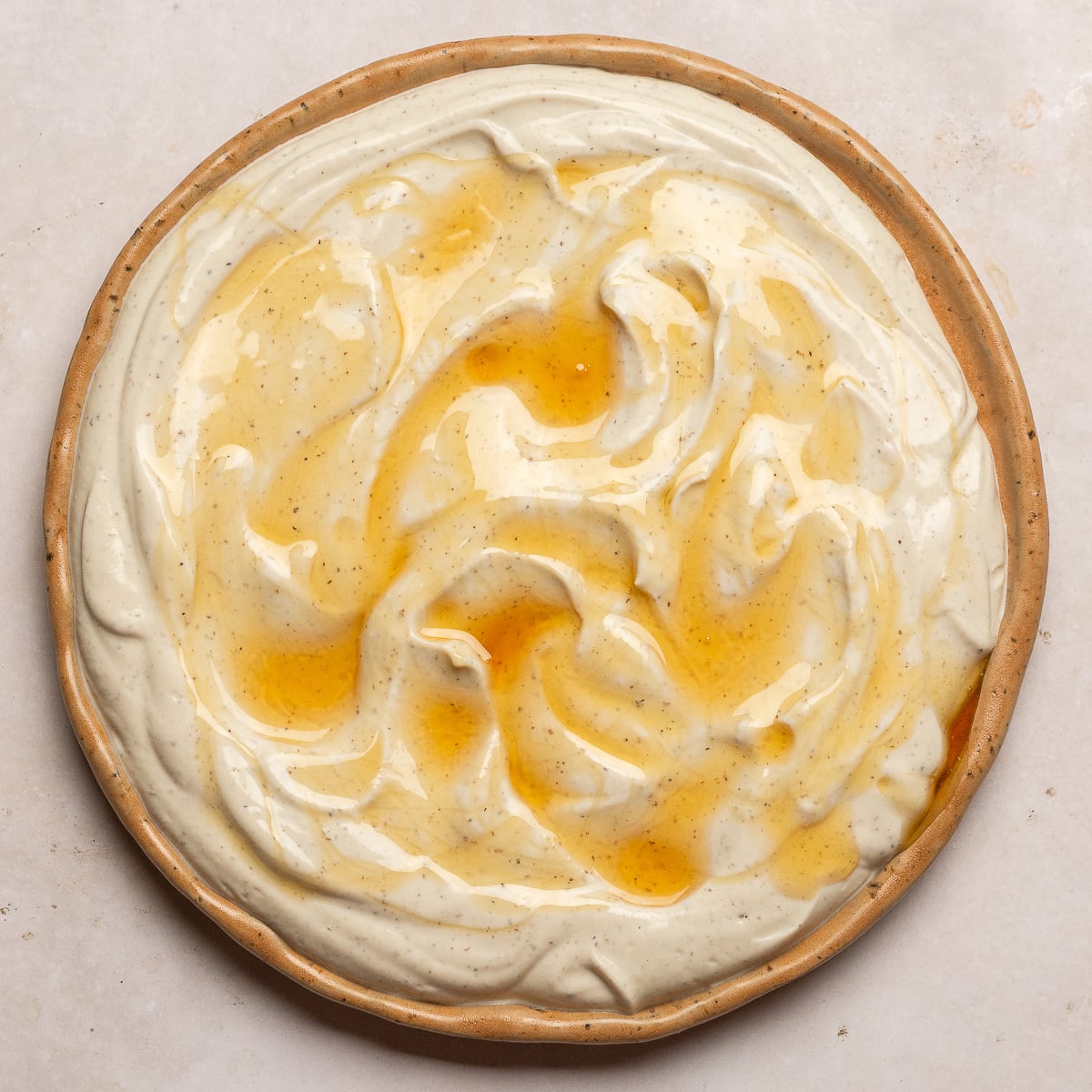 truffle whipped ricotta with honey on a plate.