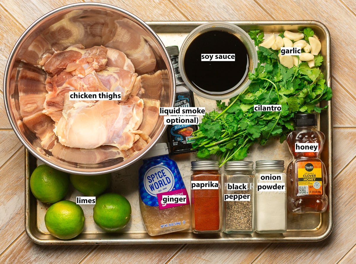 ingredients for cilantro lime chicken - chicken thighs, cilantro, lime juice, garlic, paprika, onion powder, black pepper, ginger, soy sauce, honey.
