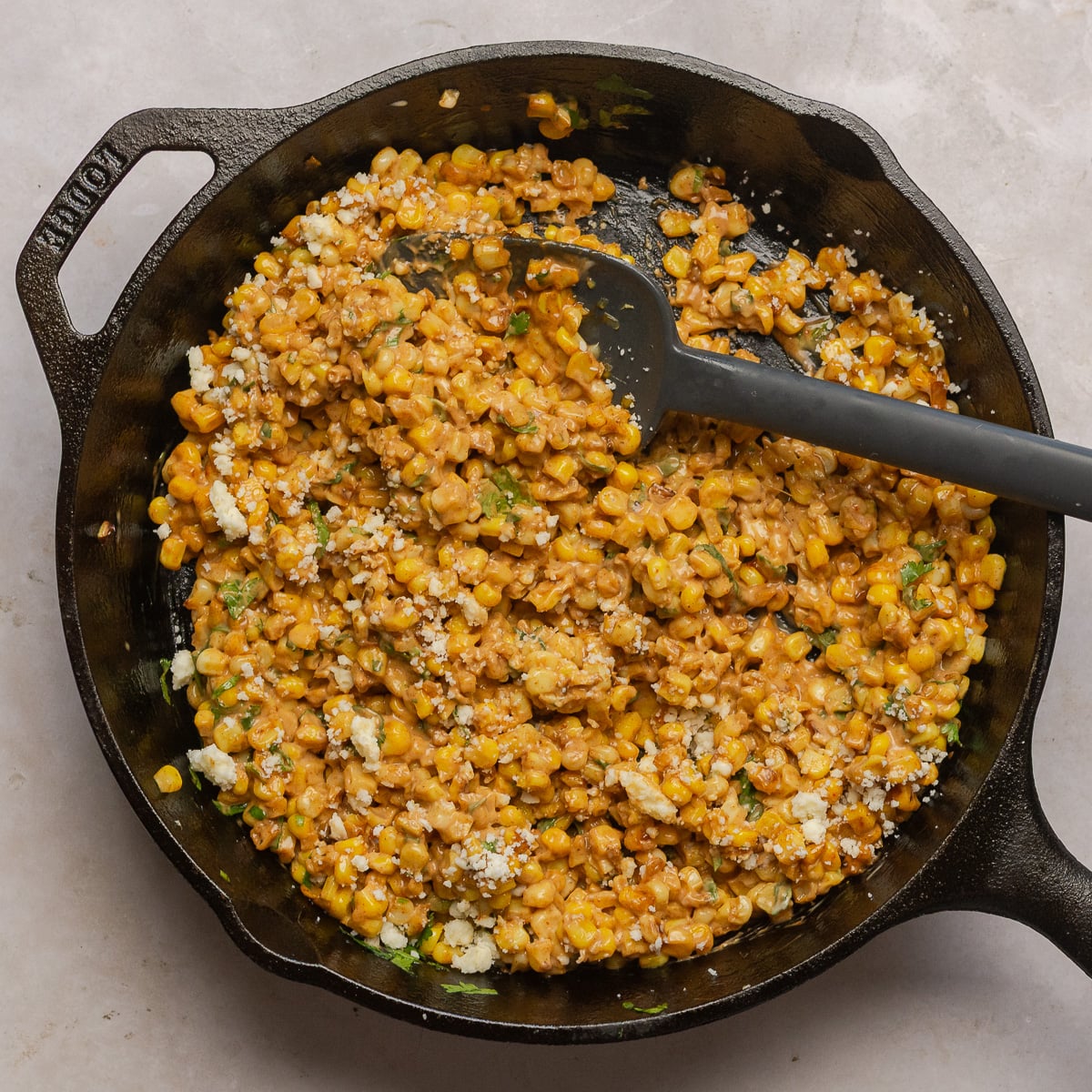 Mexican street corn salad in a skillet.
