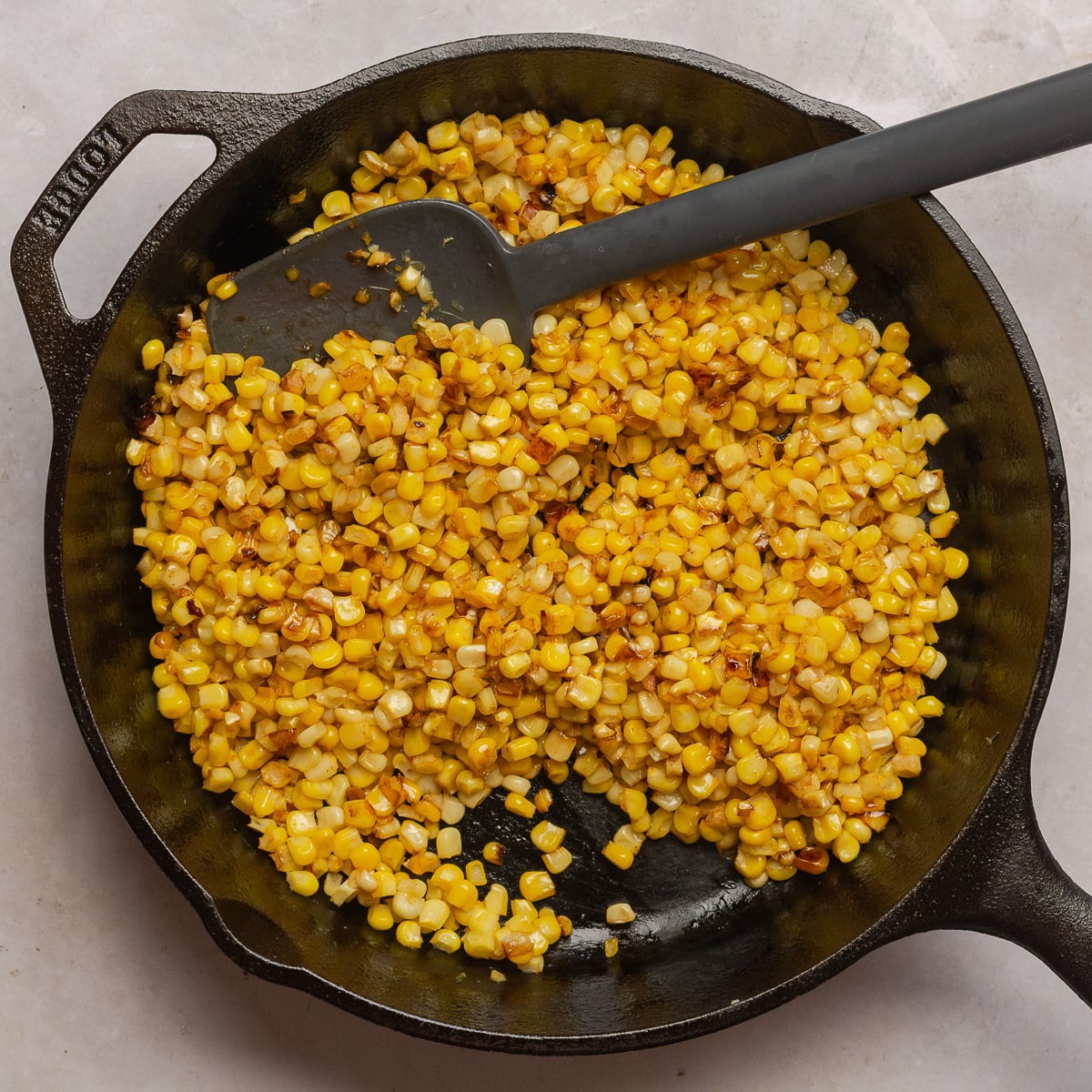 browning fresh corn in a skillet.