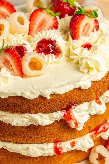 lychee cake on a cake stand.