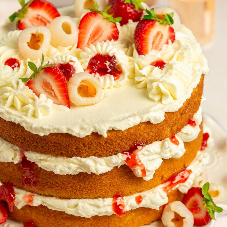 lychee cake on a cake stand.