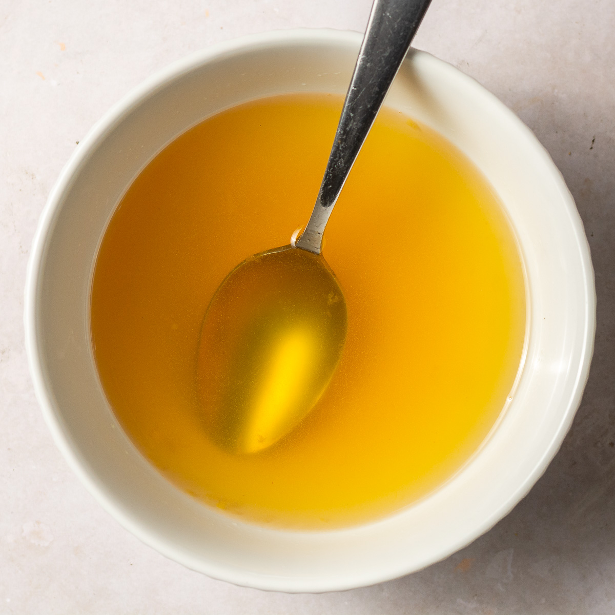 pineapple rum simple syrup in a bowl.