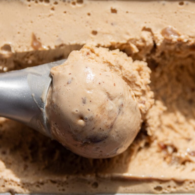 ice cream scoop with butter pecan ice cream.