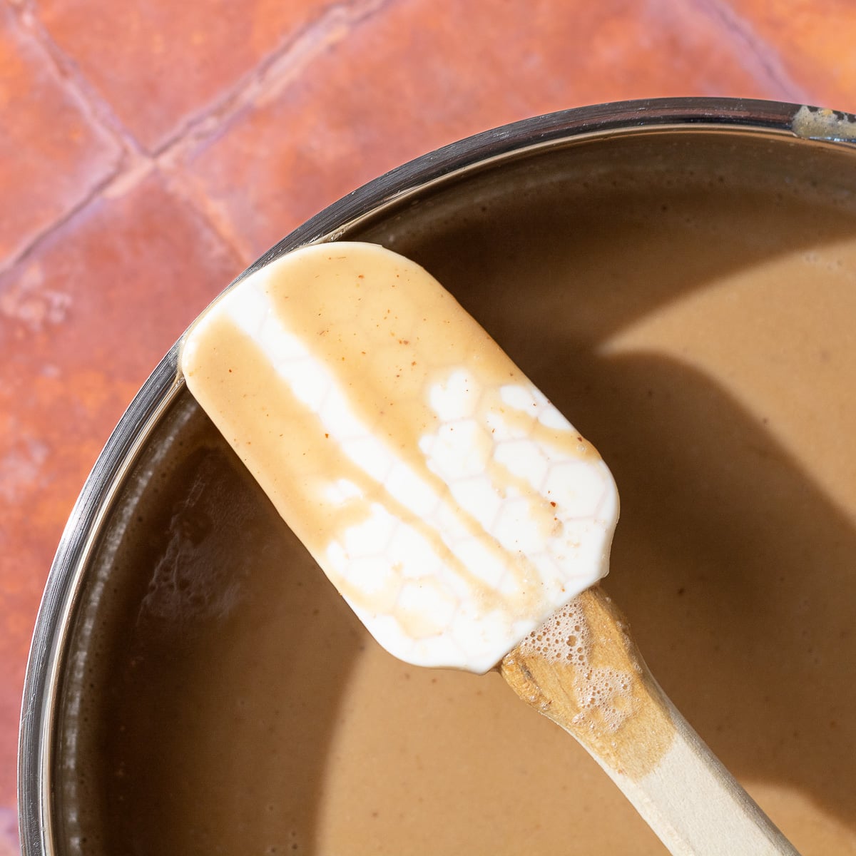 nappé consistency of butter pecan ice cream custard on a spatula.