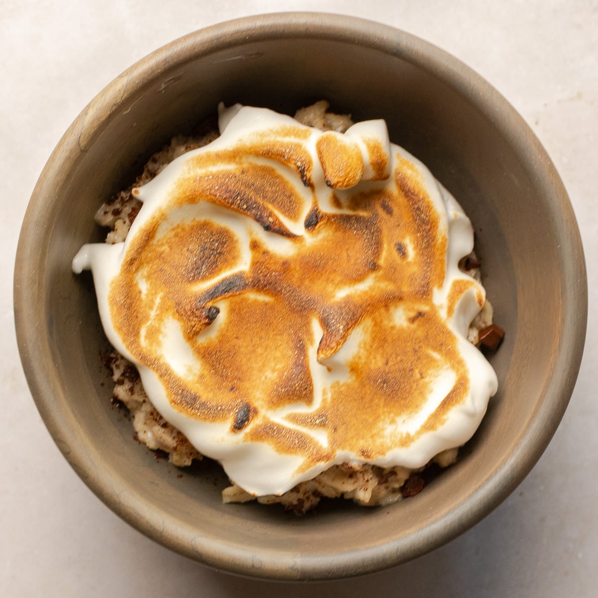 smores oatmeal in a wooden bowl.