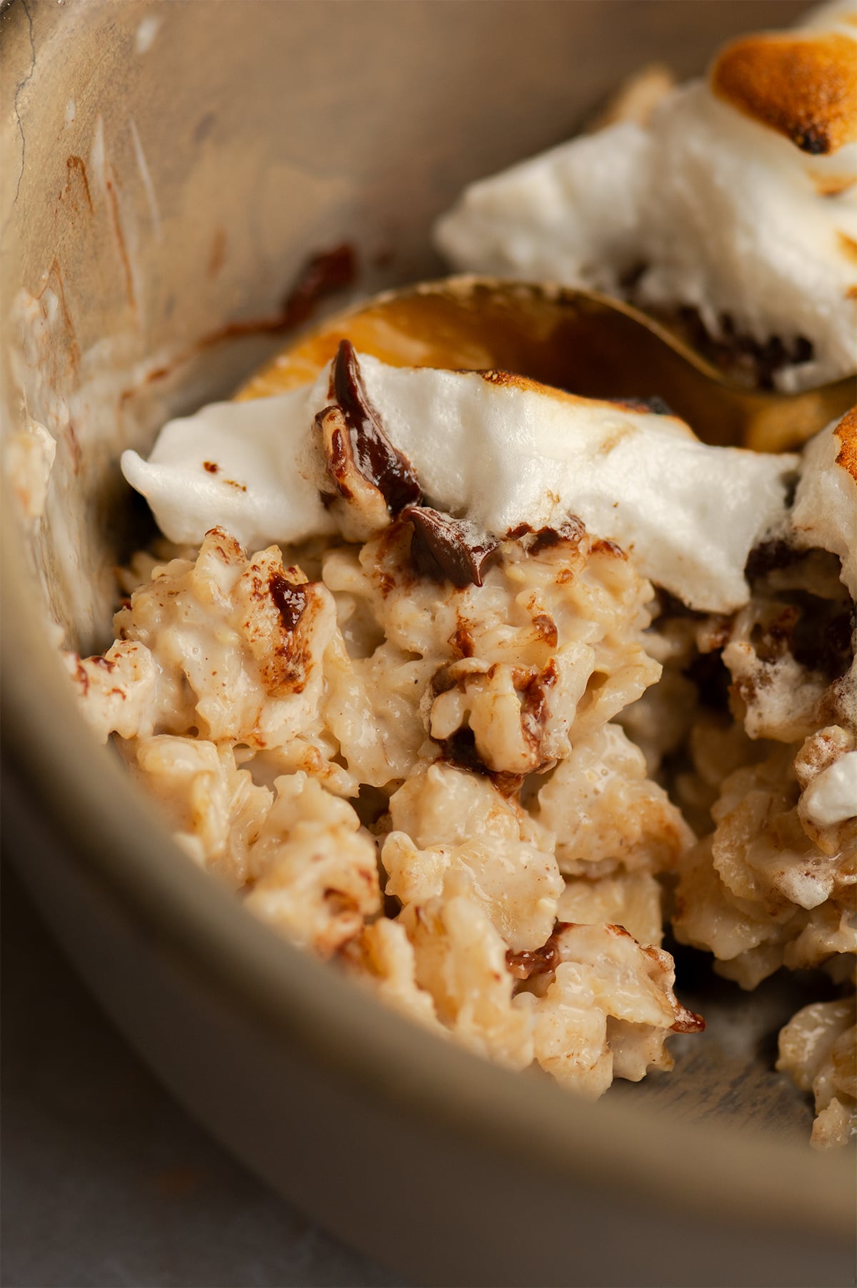 smores oatmeal being scooped up with spoon.